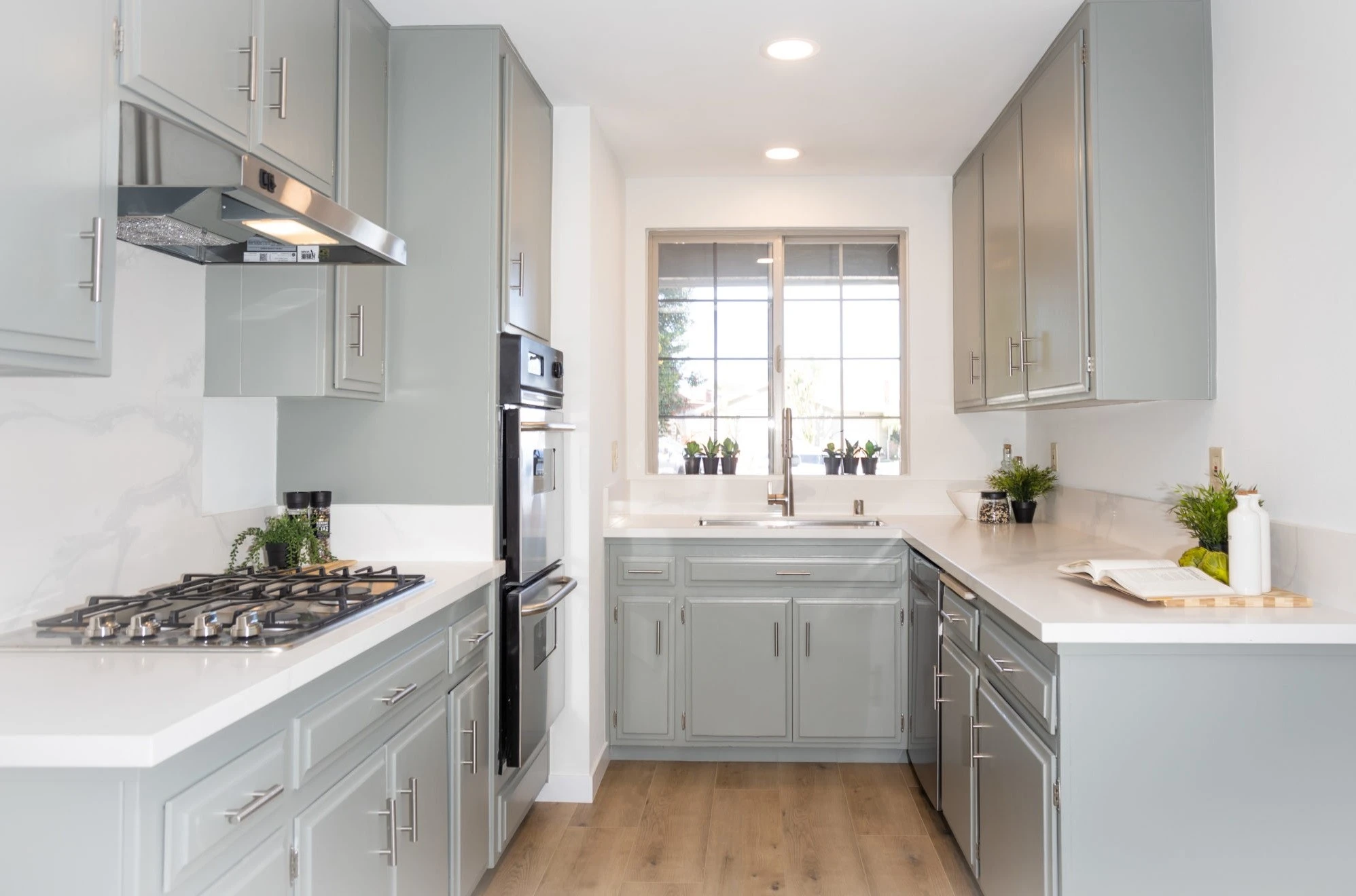 Small kitchen remodeling project with updated cabinets and finishes